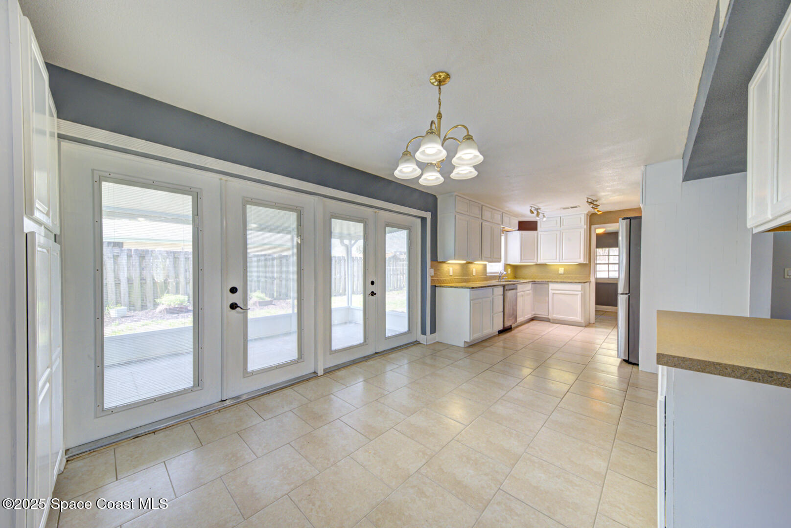 949 Brunswick Lane Rockledge, FL 32955 - Photo 14 of 43 a view of a house with a dining table & chairs
