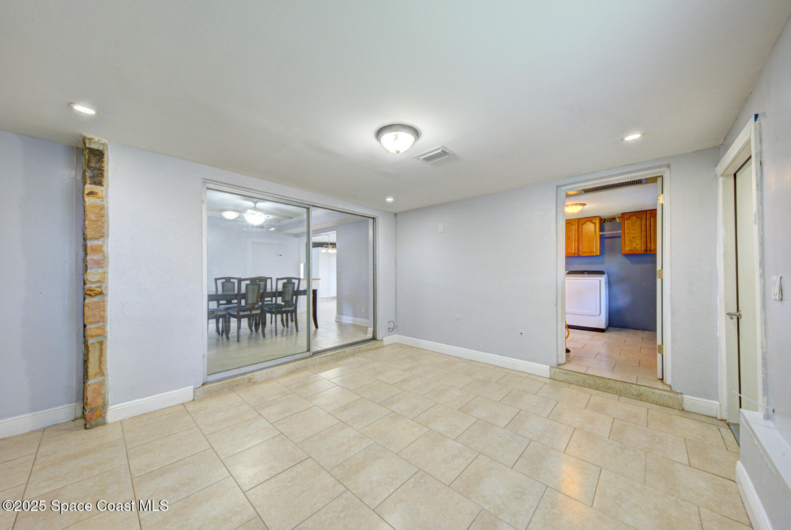 949 Brunswick Lane Rockledge, FL 32955 - Photo 22 of 43 an empty room with furniture and a window