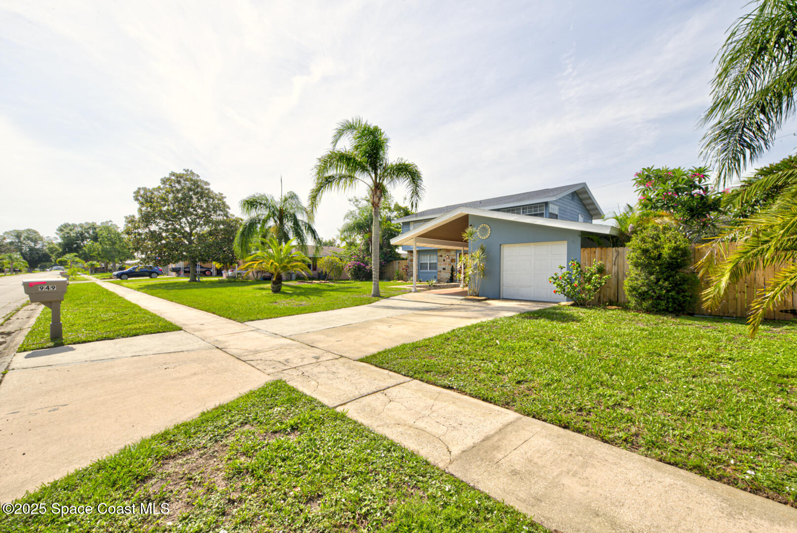 949 Brunswick Lane Rockledge, FL 32955 - Photo 3 of 43 a yellow and red house with a yard
