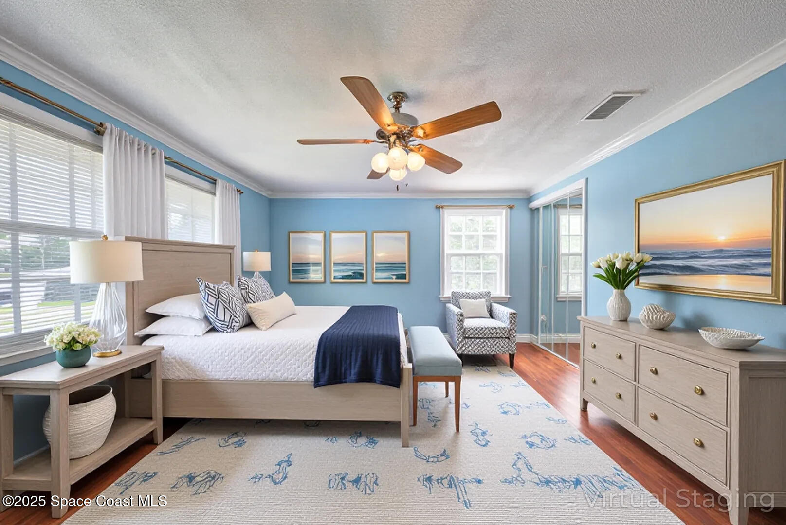 949 Brunswick Lane Rockledge, FL 32955 - Photo 34 of 43 a bedroom with a bed a couch and a flat tv screen on dresser