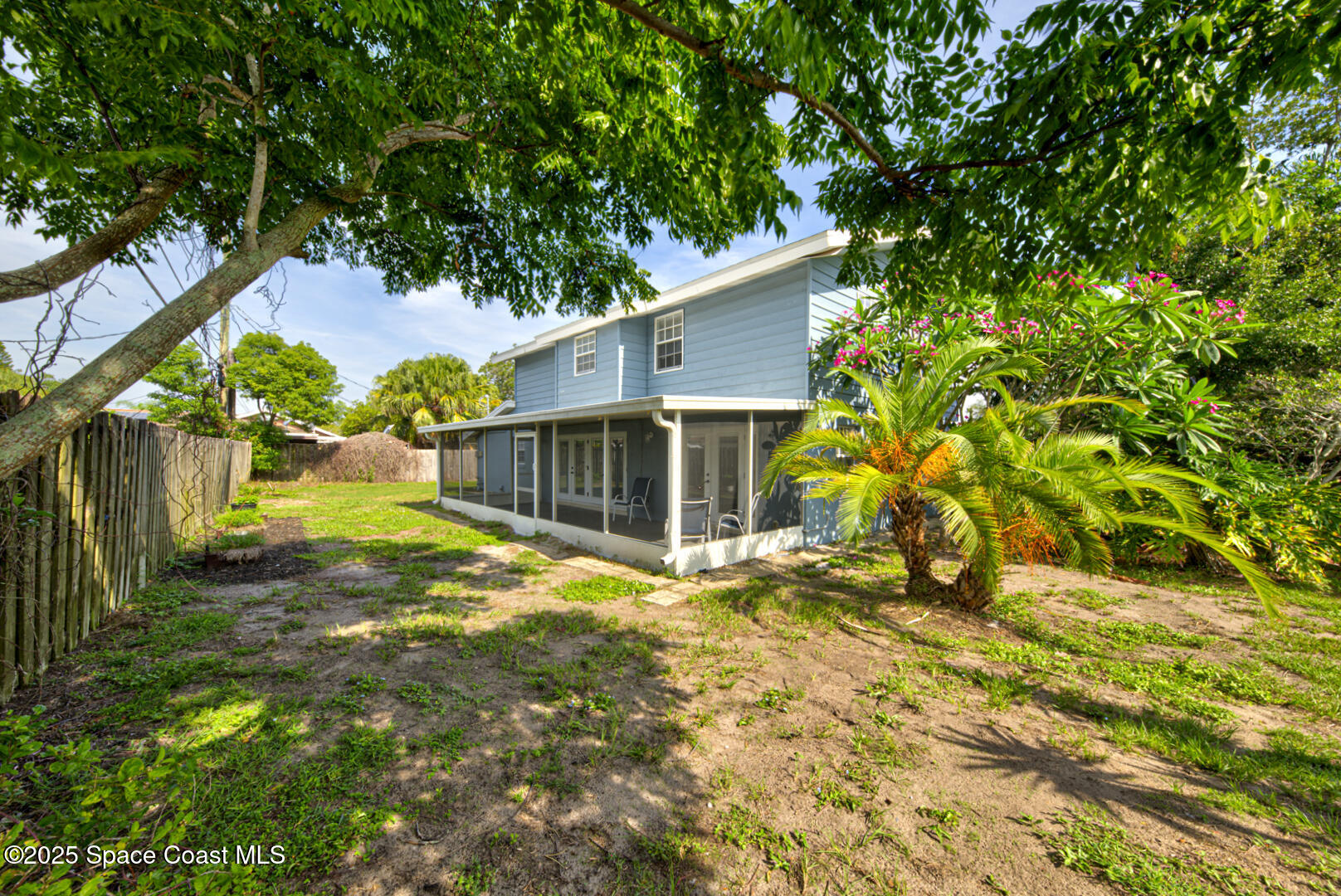 949 Brunswick Lane Rockledge, FL 32955 - Photo 42 of 43 a view of a house with a yard and tree