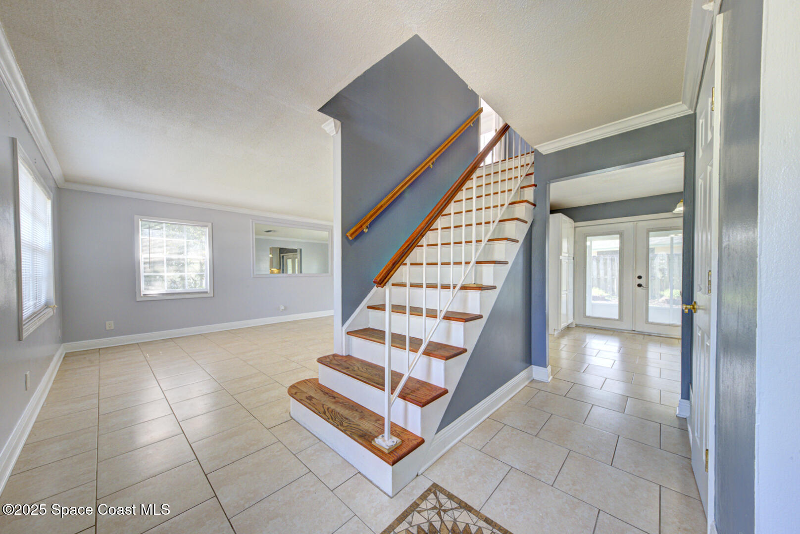 949 Brunswick Lane Rockledge, FL 32955 - Photo 7 of 43 a view of an entryway with wooden floor