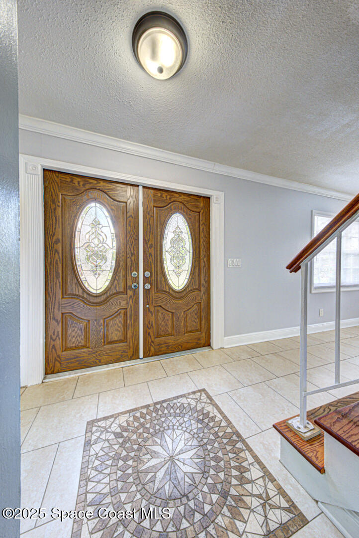 949 Brunswick Lane Rockledge, FL 32955 - Photo 8 of 43 a view of a hallway with entryway