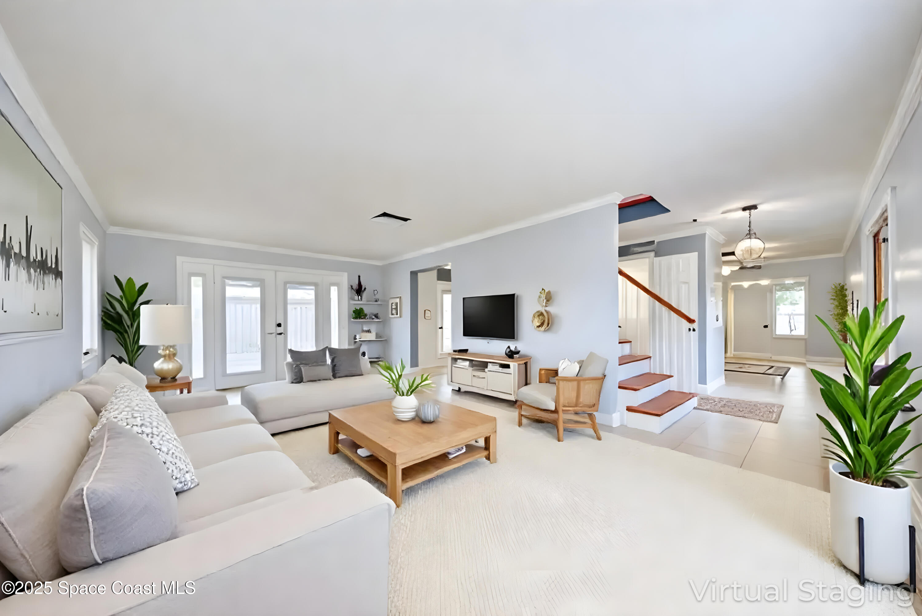 949 Brunswick Lane Rockledge, FL 32955 - Photo 9 of 43 a living room with furniture potted plant and a large window