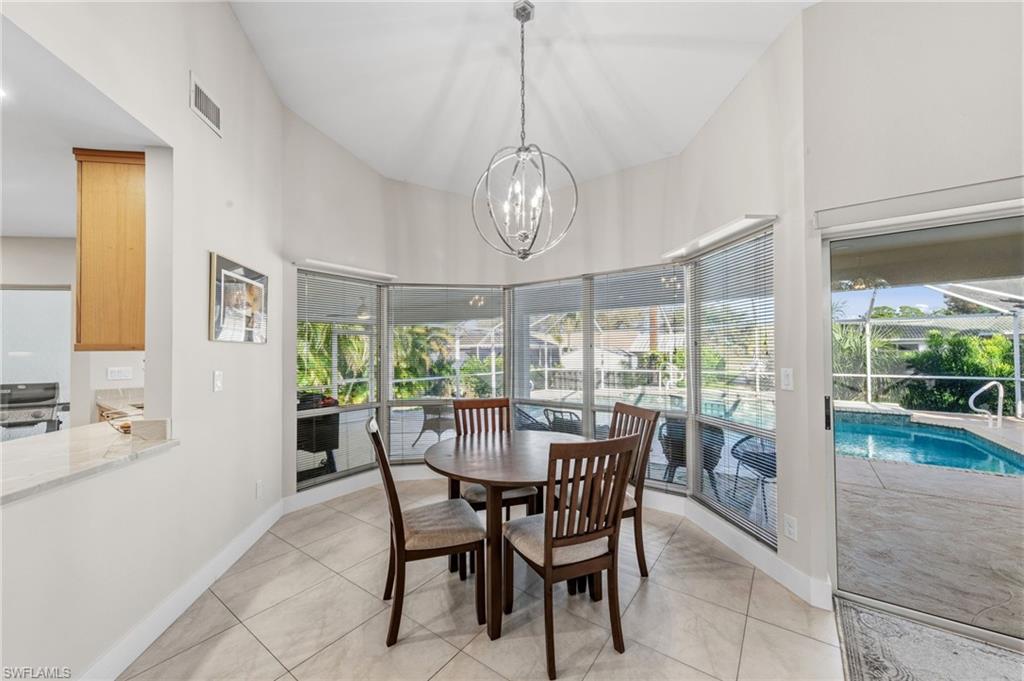 4724 Riverside Drive Estero, FL 33928 - Photo 13 of 44 a view of a dining room with furniture window and outside view