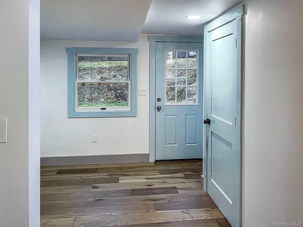 a view of room with window and hardwood floor
