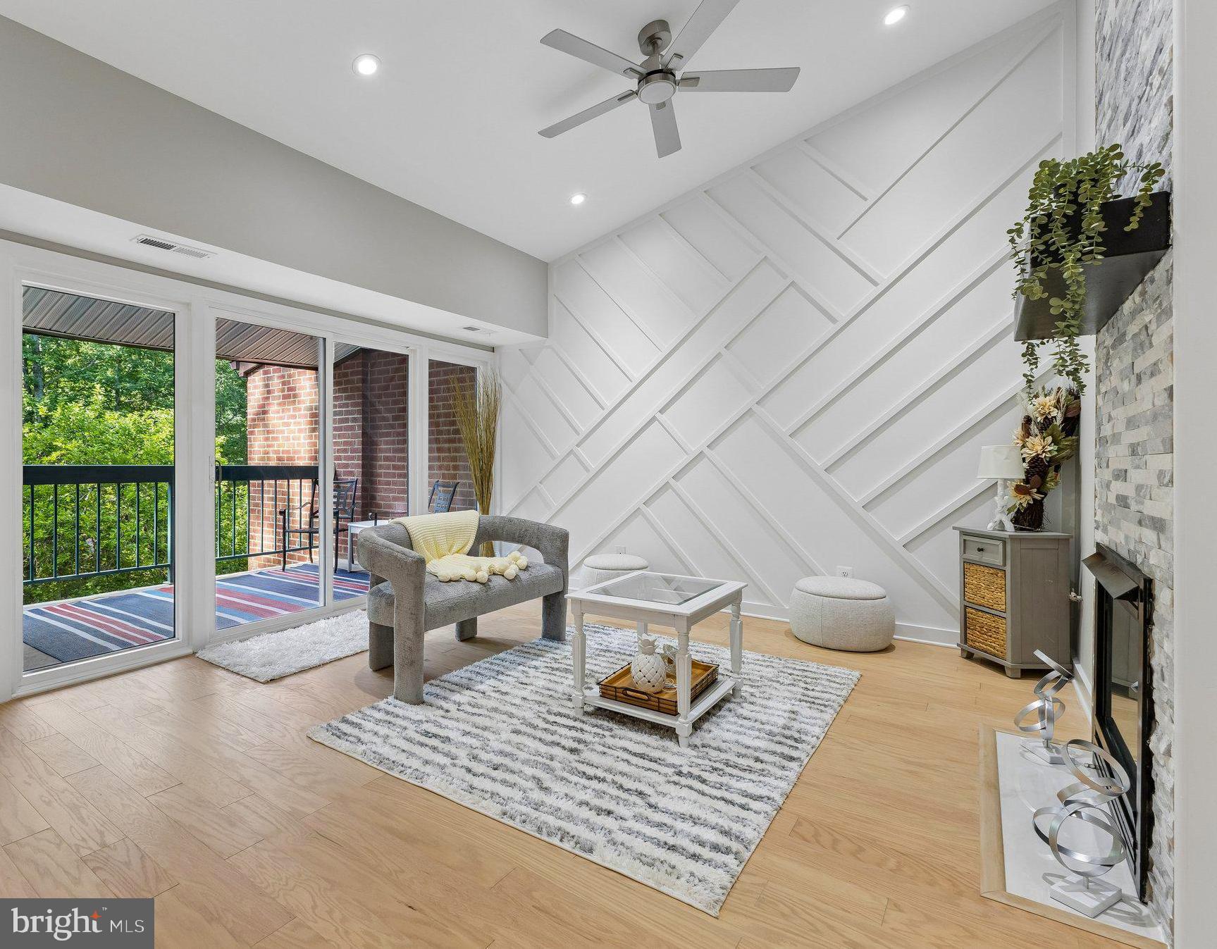 11841 Shire Court, Unit 31D Reston, VA 20191 - Photo 5 of 24 a living room with furniture and a floor to ceiling window