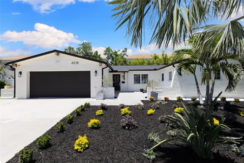 a front view of house with yard outdoor seating and barbeque oven