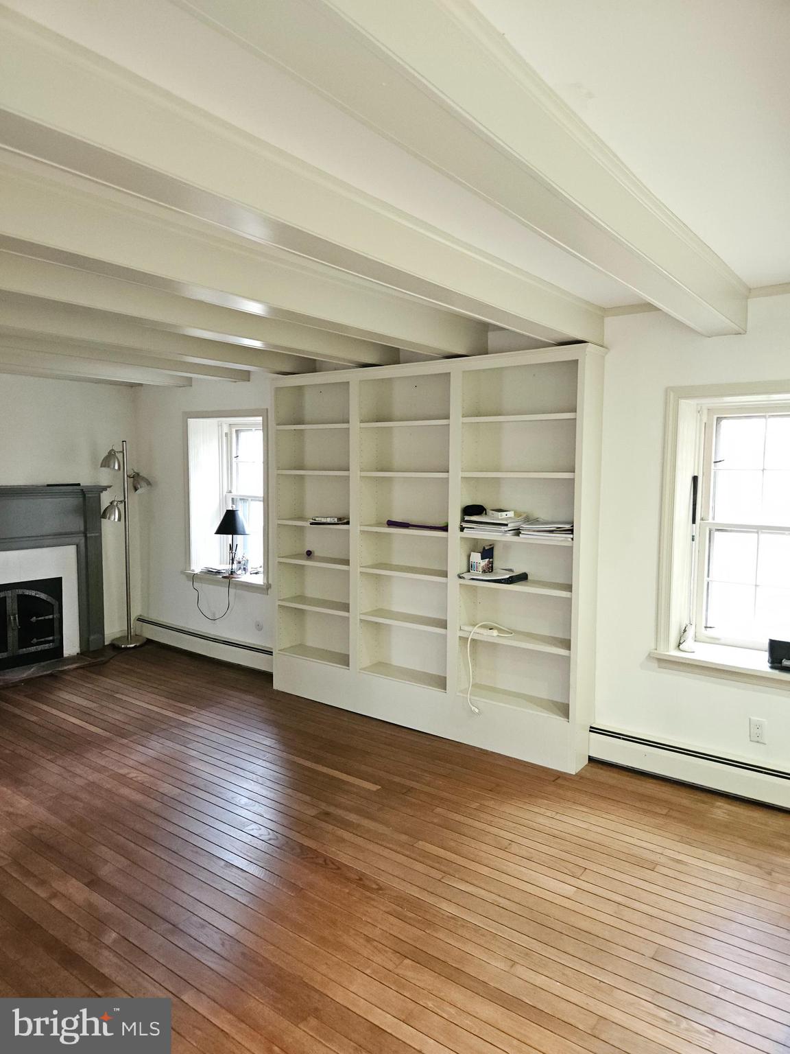 468 Lionville Station Road Chester Springs, PA 19425 - Photo 12 of 26 an empty room with wooden floor closet and windows