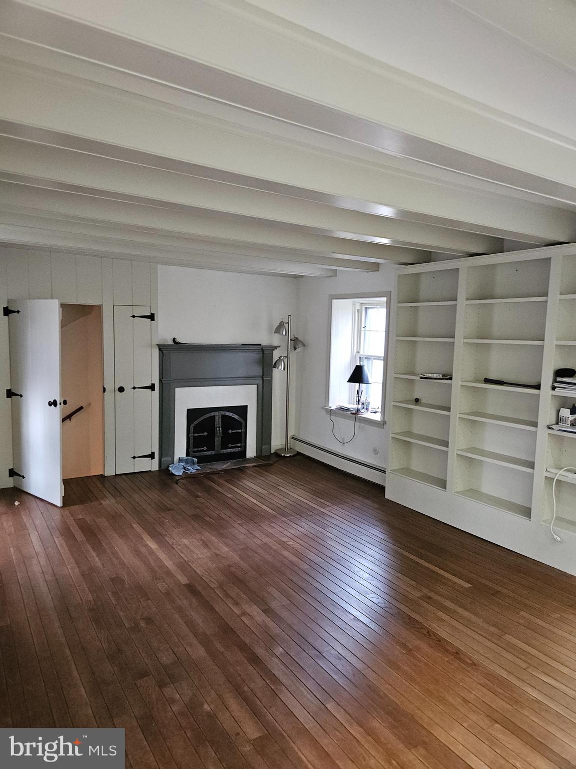 468 Lionville Station Road Chester Springs, PA 19425 - Photo 13 of 26 a view of an empty room with a fireplace and a window