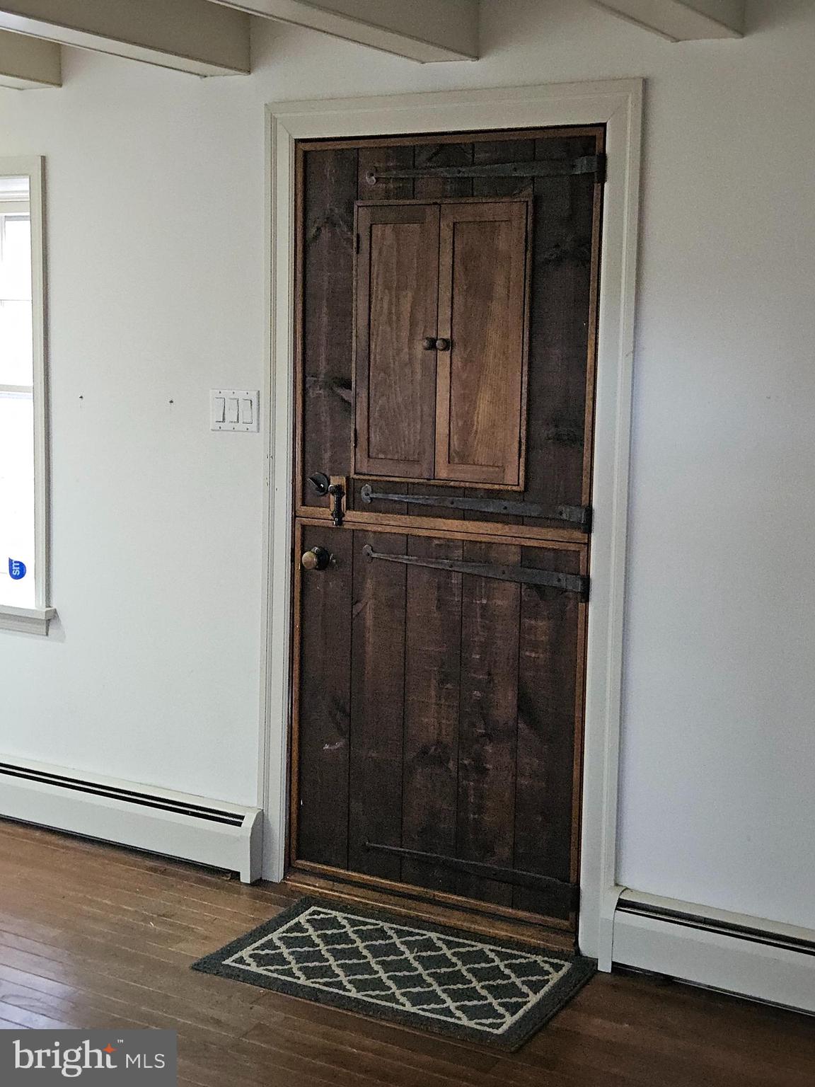 468 Lionville Station Road Chester Springs, PA 19425 - Photo 14 of 26 an empty room with wooden floor and a window