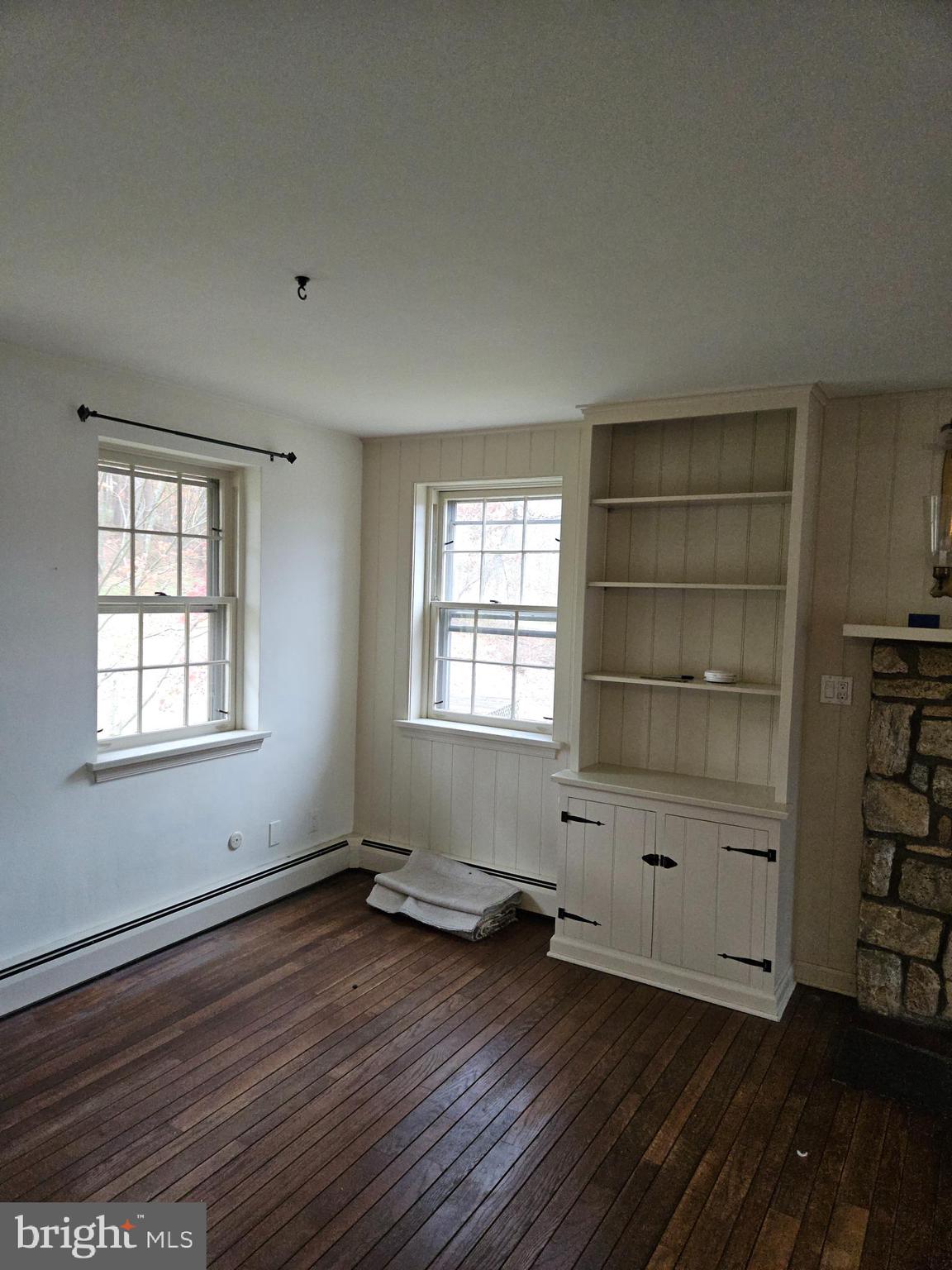 468 Lionville Station Road Chester Springs, PA 19425 - Photo 2 of 26 an empty room with wooden floor and windows