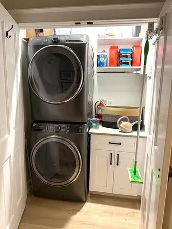 a view of a patio with table and chairs and potted plants