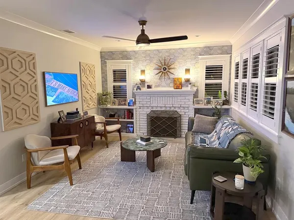 a living room with furniture and a fireplace