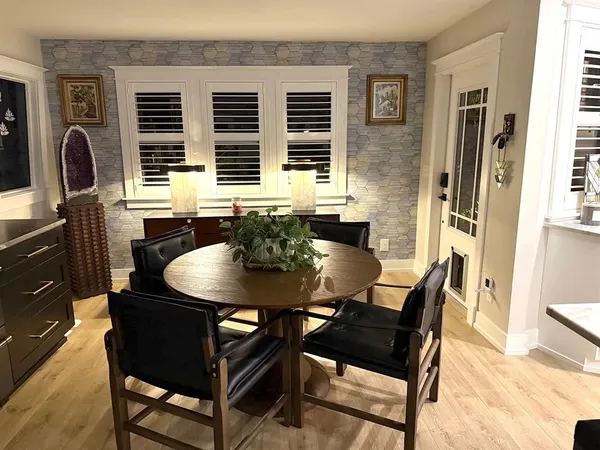 a view of a dining room with furniture and window