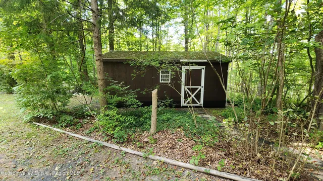 front view of a house with a garden