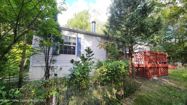 front view of a house with a tree