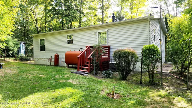 a view of backyard with a garden and plants