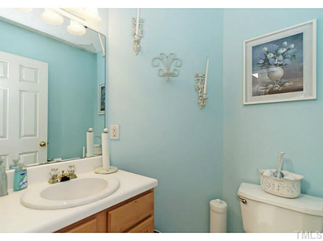 2217 Woodwyck Way Raleigh, NC 27604 - Photo 12 of 25 a bathroom with a sink vanity and a mirror