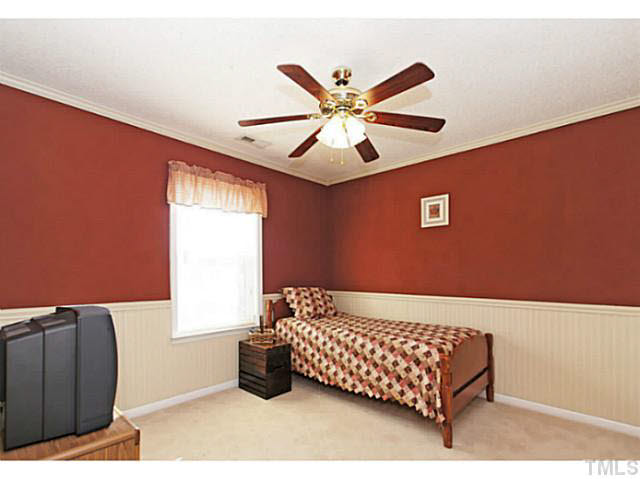 2217 Woodwyck Way Raleigh, NC 27604 - Photo 18 of 25 a bedroom with a bed and a window