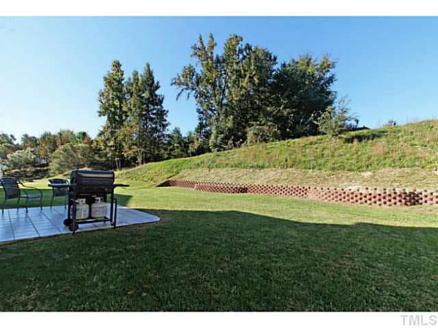 2217 Woodwyck Way Raleigh, NC 27604 - Photo 23 of 25 a view of a park with a bench and trees