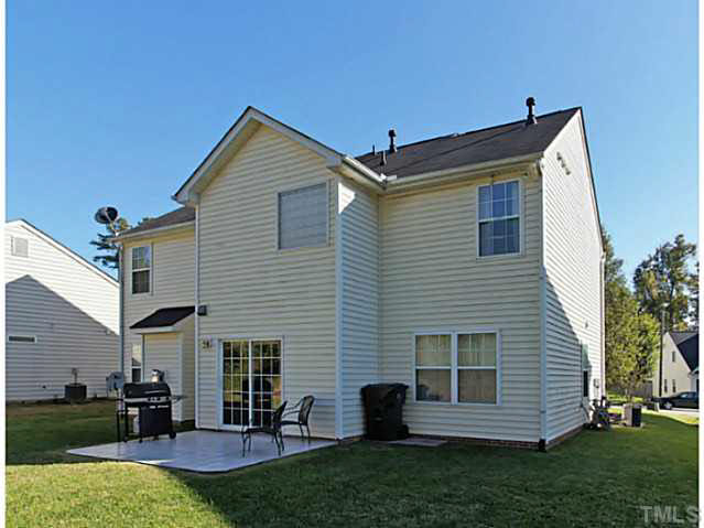 2217 Woodwyck Way Raleigh, NC 27604 - Photo 24 of 25 a backyard of a house with table and chairs