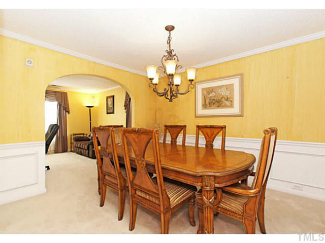2217 Woodwyck Way Raleigh, NC 27604 - Photo 5 of 25 a dining room with furniture and chandelier