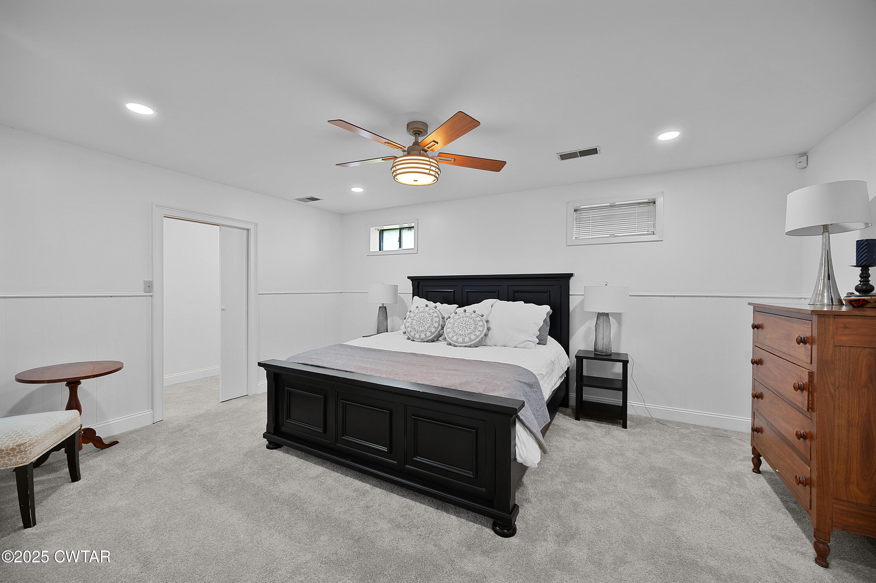 1882 Sand Ridge Bargerton Road Lexington, TN 38351 - Photo 11 of 34 a spacious bedroom with a bed and a lamp on a dresser