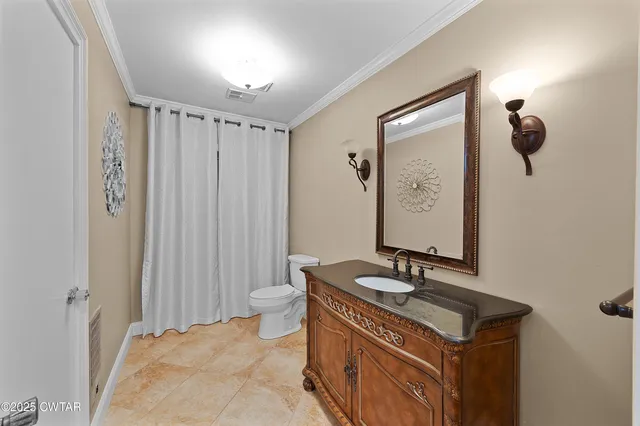 a hallway with cabinets and book shelf