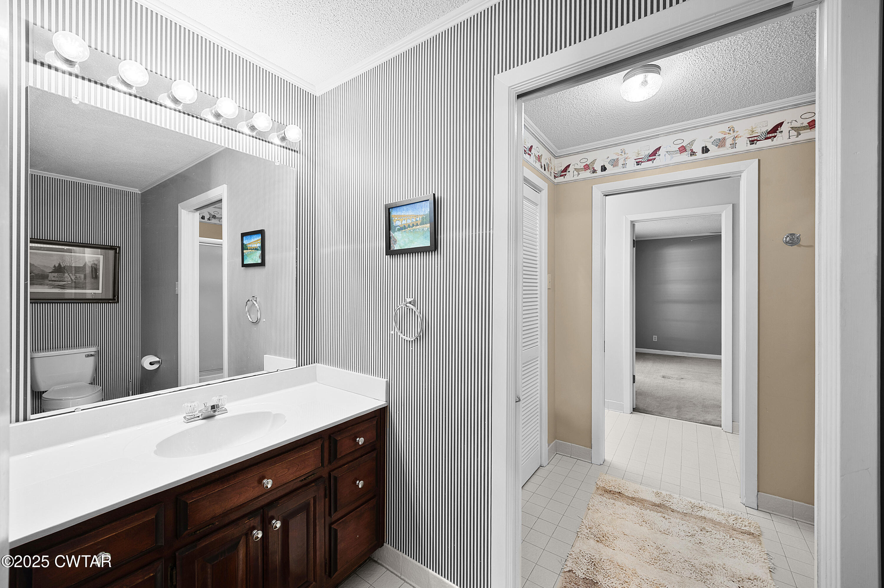 1882 Sand Ridge Bargerton Road Lexington, TN 38351 - Photo 20 of 34 a bathroom with a sink vanity and a mirror