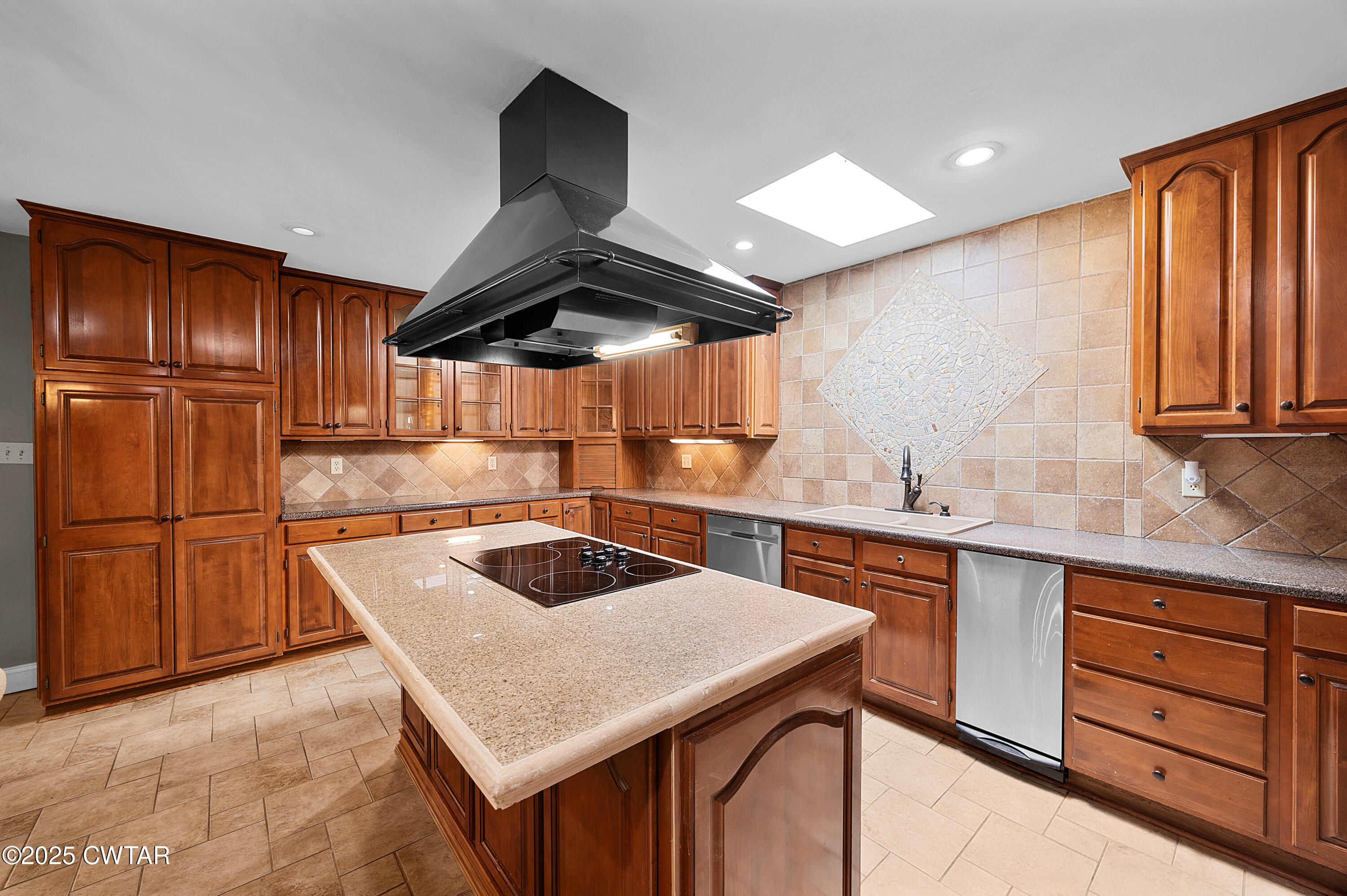1882 Sand Ridge Bargerton Road Lexington, TN 38351 - Photo 22 of 34 a kitchen with granite countertop a sink stainless steel appliances and cabinets