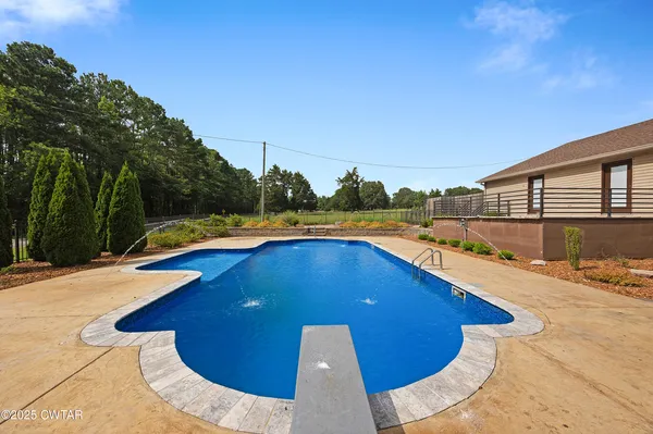 a view of a swimming pool with a lounge chair