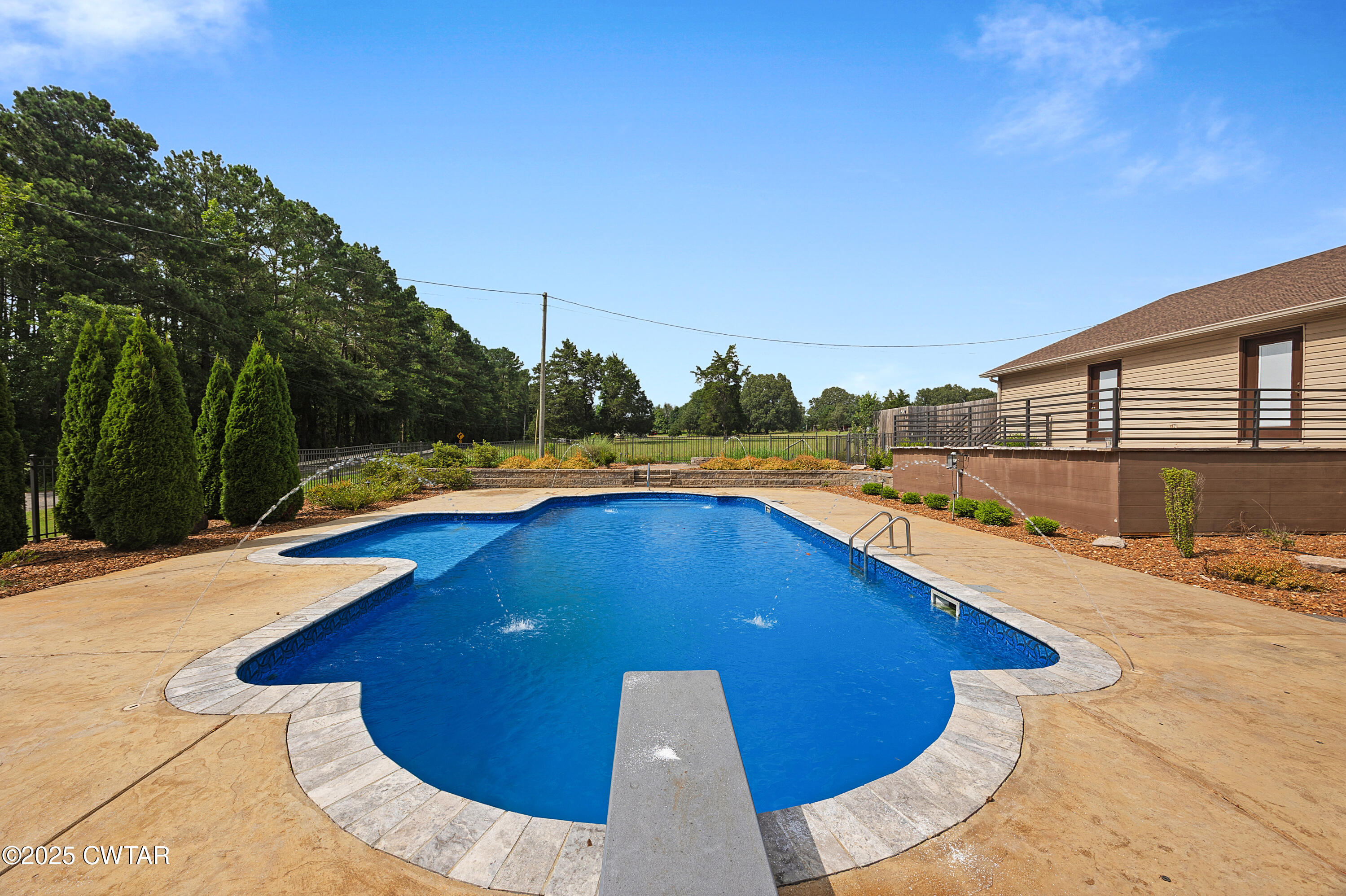 1882 Sand Ridge Bargerton Road Lexington, TN 38351 - Photo 4 of 34 a view of a swimming pool with a lounge chair