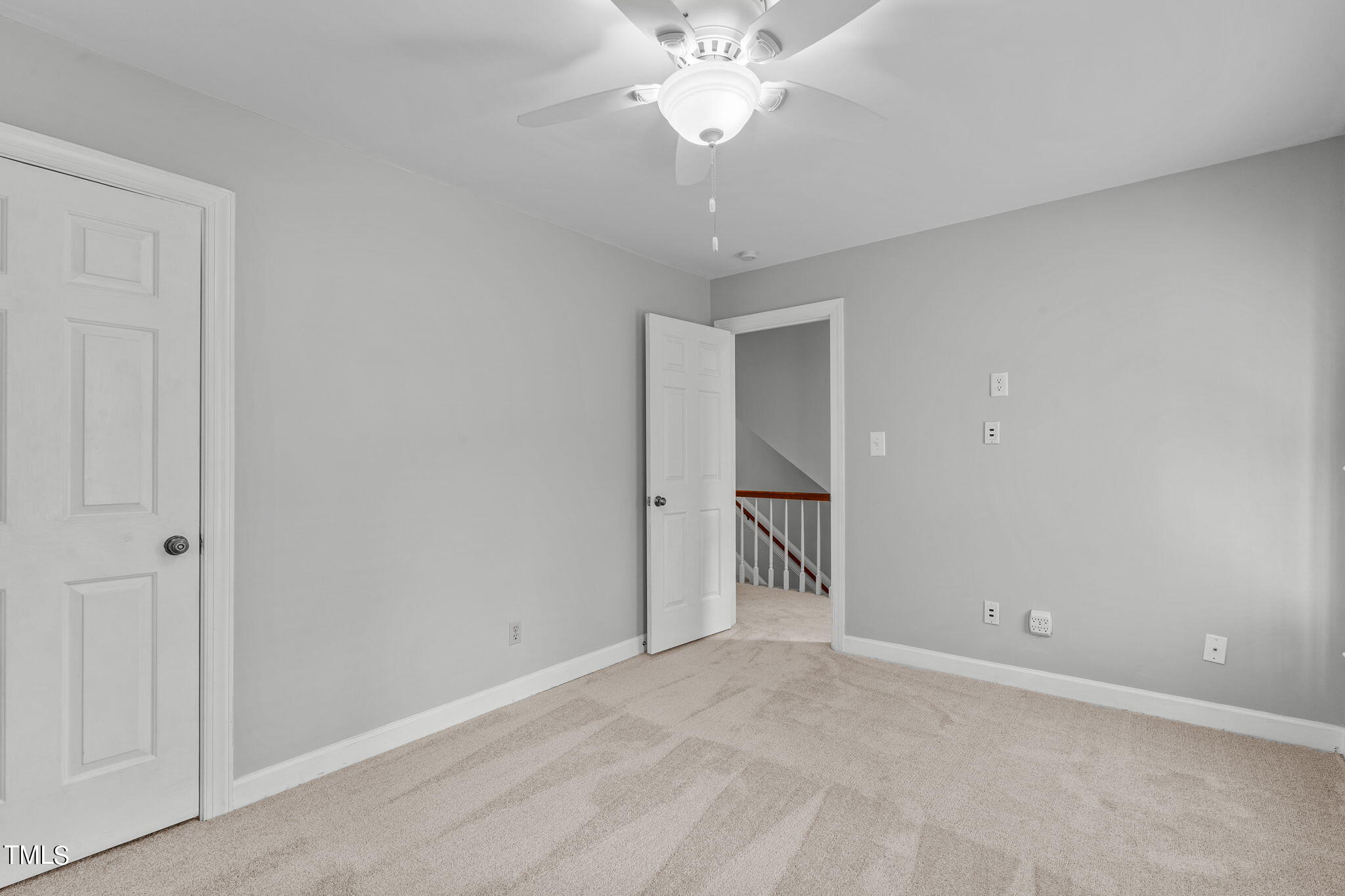 8808 Bickley Place Raleigh, NC 27613 - Photo 27 of 43 a view of an empty room with a chandelier fan