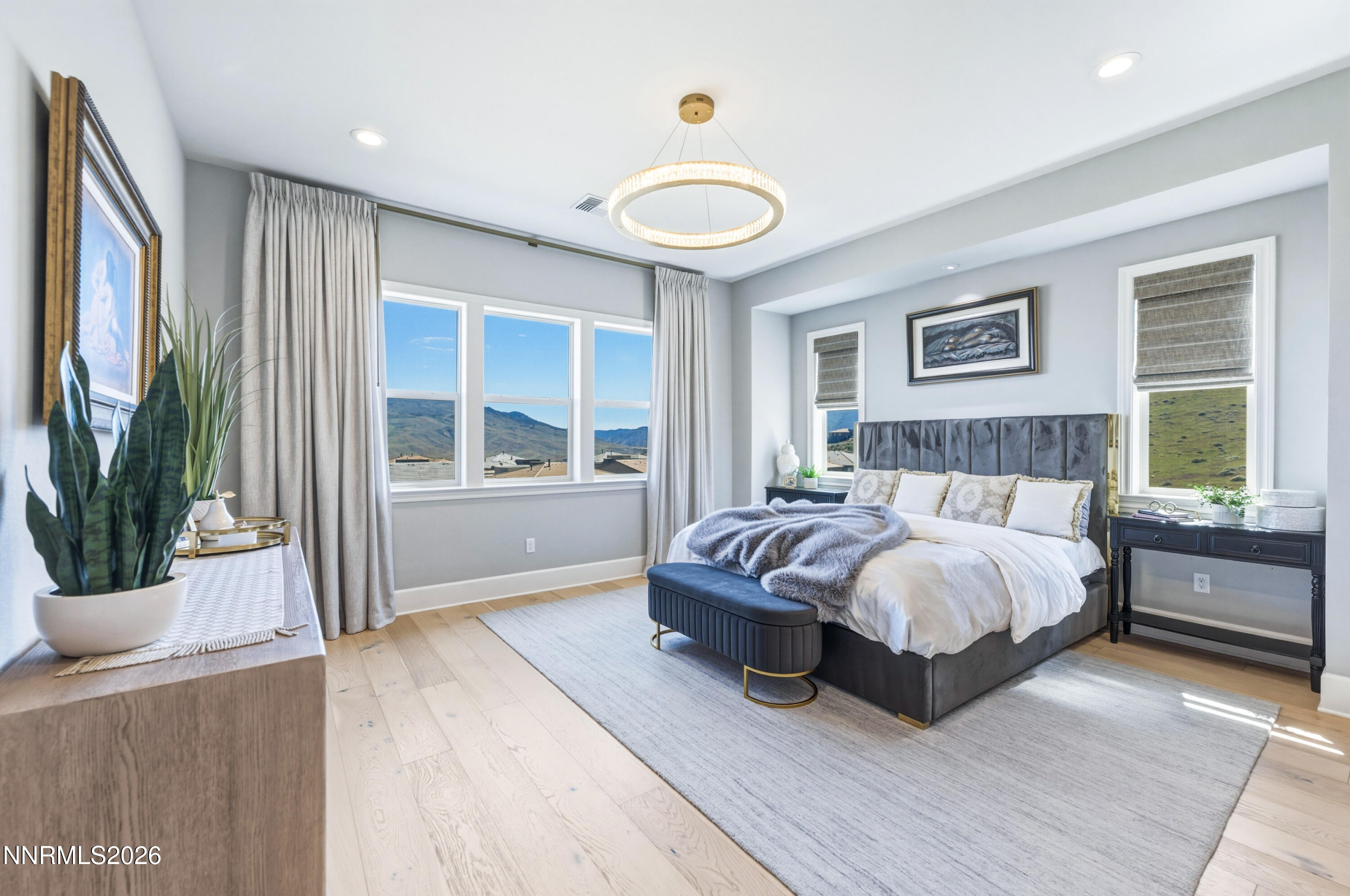 9028 Iron Sky Court Reno, NV 89523 - Photo 10 of 36 a bedroom with a large bed and a large window
