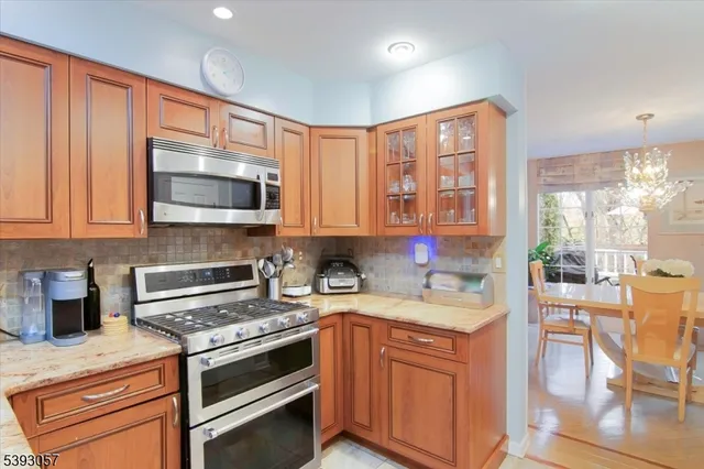 a kitchen with a stove a sink and a microwave