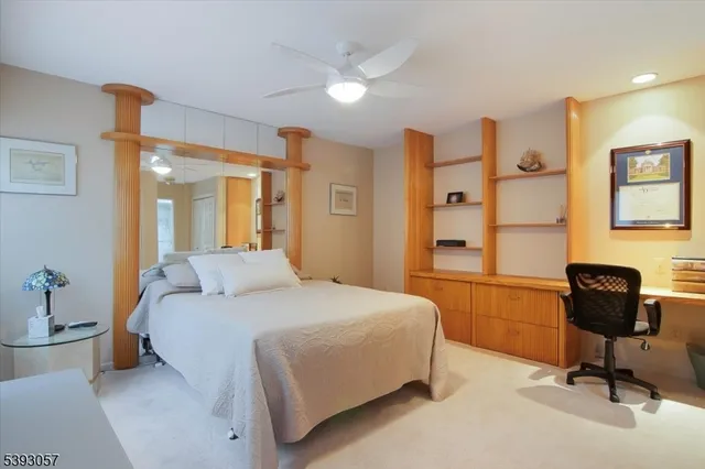 a bedroom with a bed and a chair