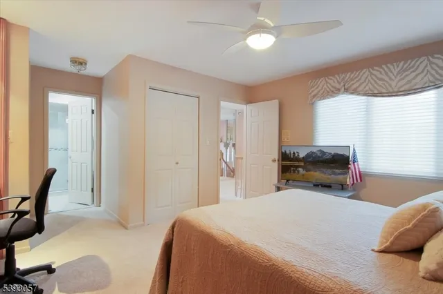 a bedroom with a bed and a chair