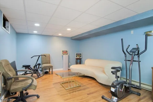 a room with a couch and a gym equipment
