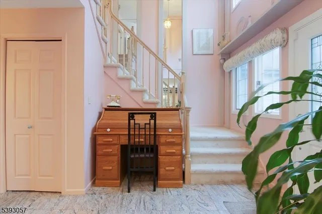 a view of entryway livingroom and hall with wooden floor