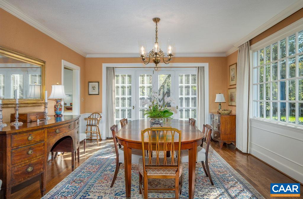 35 Old Farm Road Charlottesville, VA 22903 - Photo 13 of 44 a dining room with furniture a chandelier and wooden floor