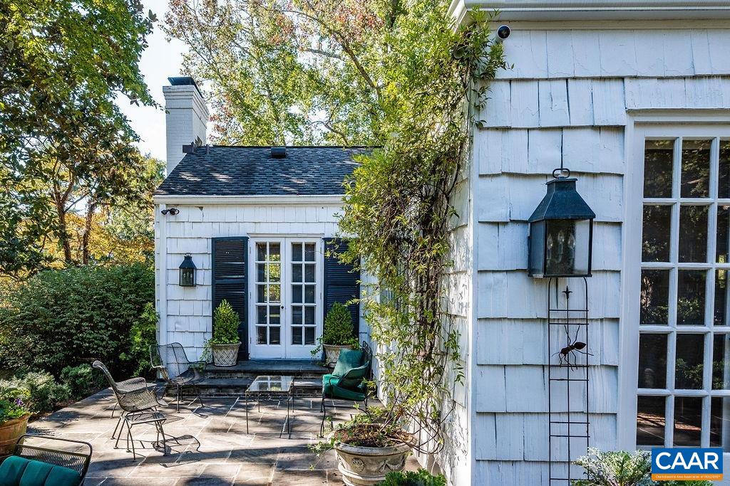 35 Old Farm Road Charlottesville, VA 22903 - Photo 15 of 44 a front view of a house with glass windows and plants