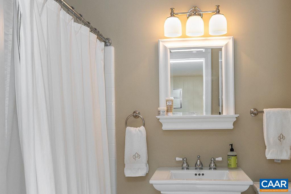 35 Old Farm Road Charlottesville, VA 22903 - Photo 40 of 44 a bathroom with a sink mirror and vanity