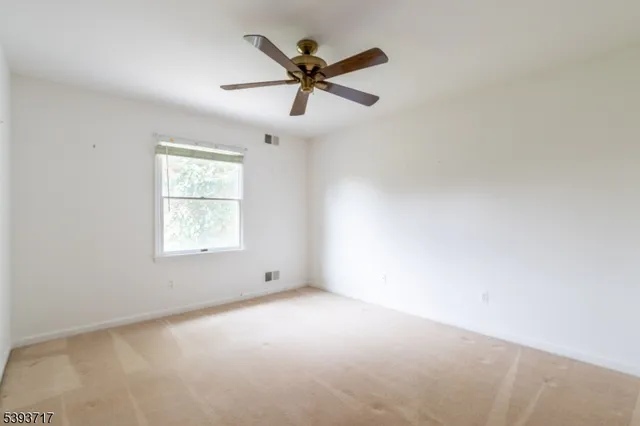 a bathroom with a tub sink and a mirror