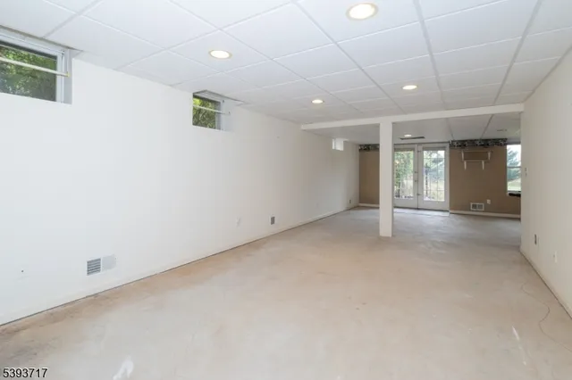 a big yard with lots of green space and trees