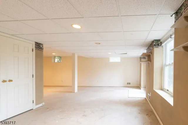 a view of an empty room with windows