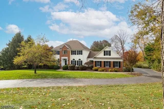a kitchen with white cabinets and appliances