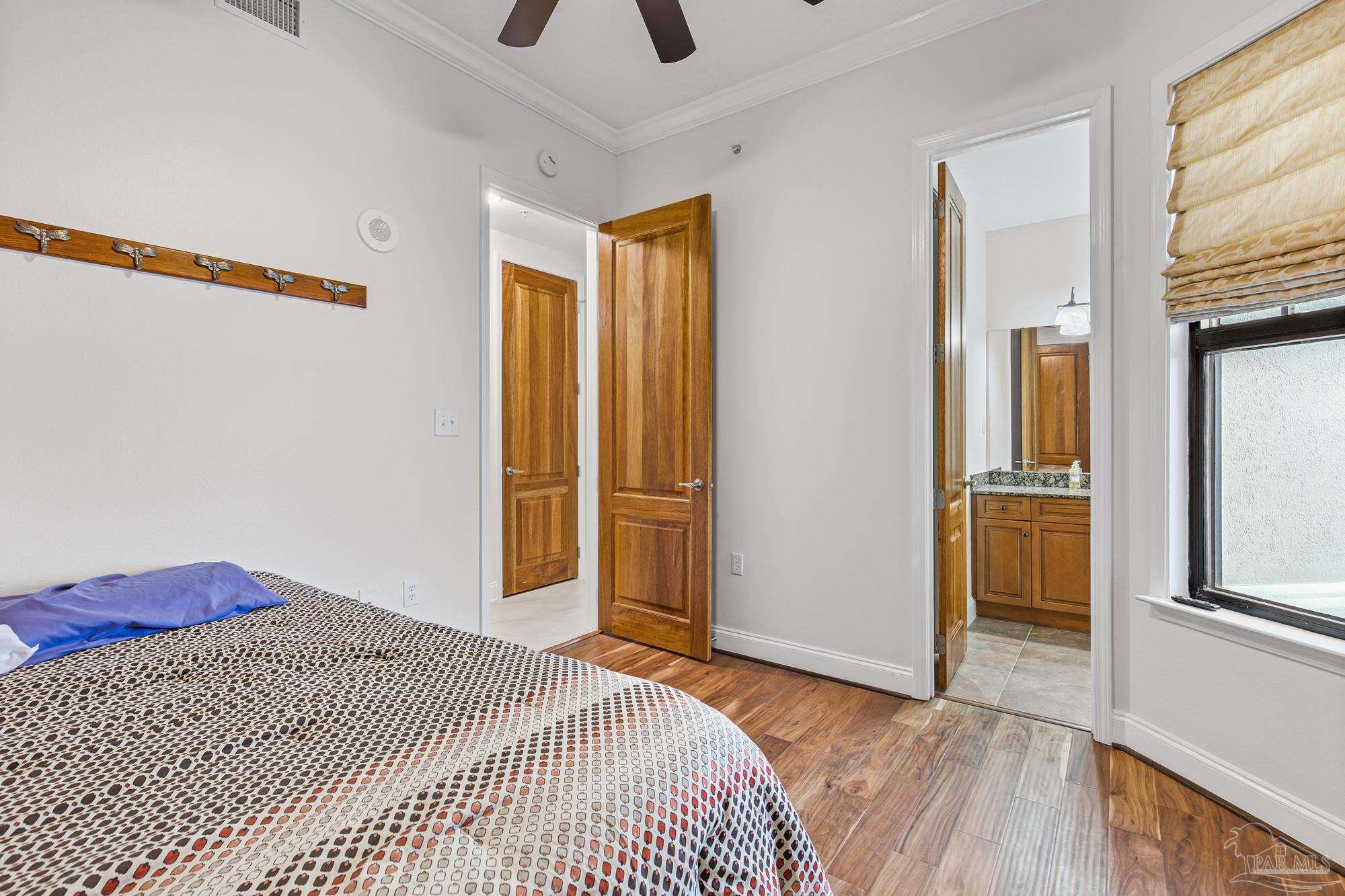 14900 River Road, Unit 904 Perdido Key, FL 32507 - Photo 18 of 62 a bedroom with a bed and a refrigerator