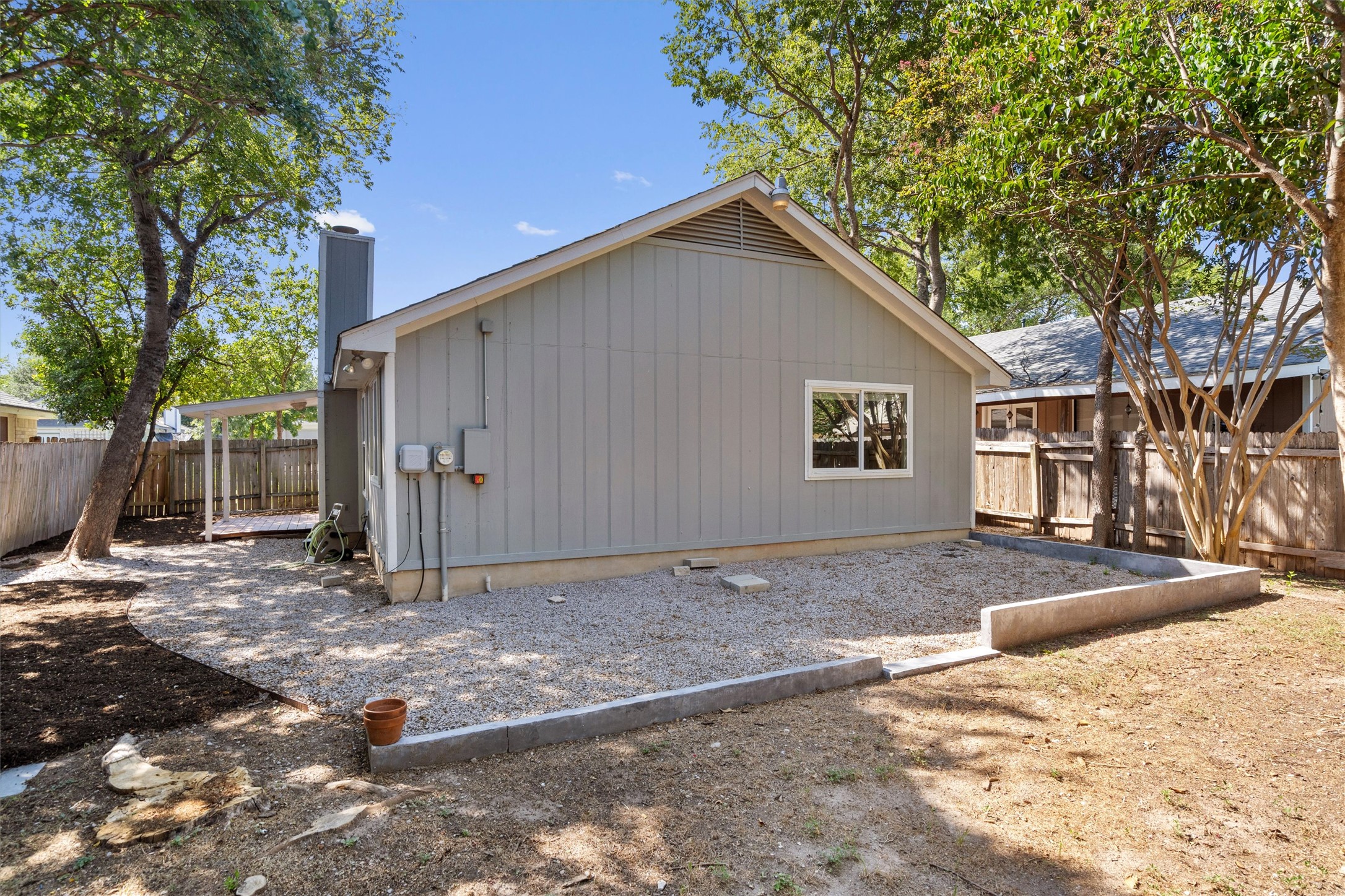12321 Emery Oaks Road Austin, TX 78758 - Photo 23 of 27 Backyard with ample space for gardening or entertaining.