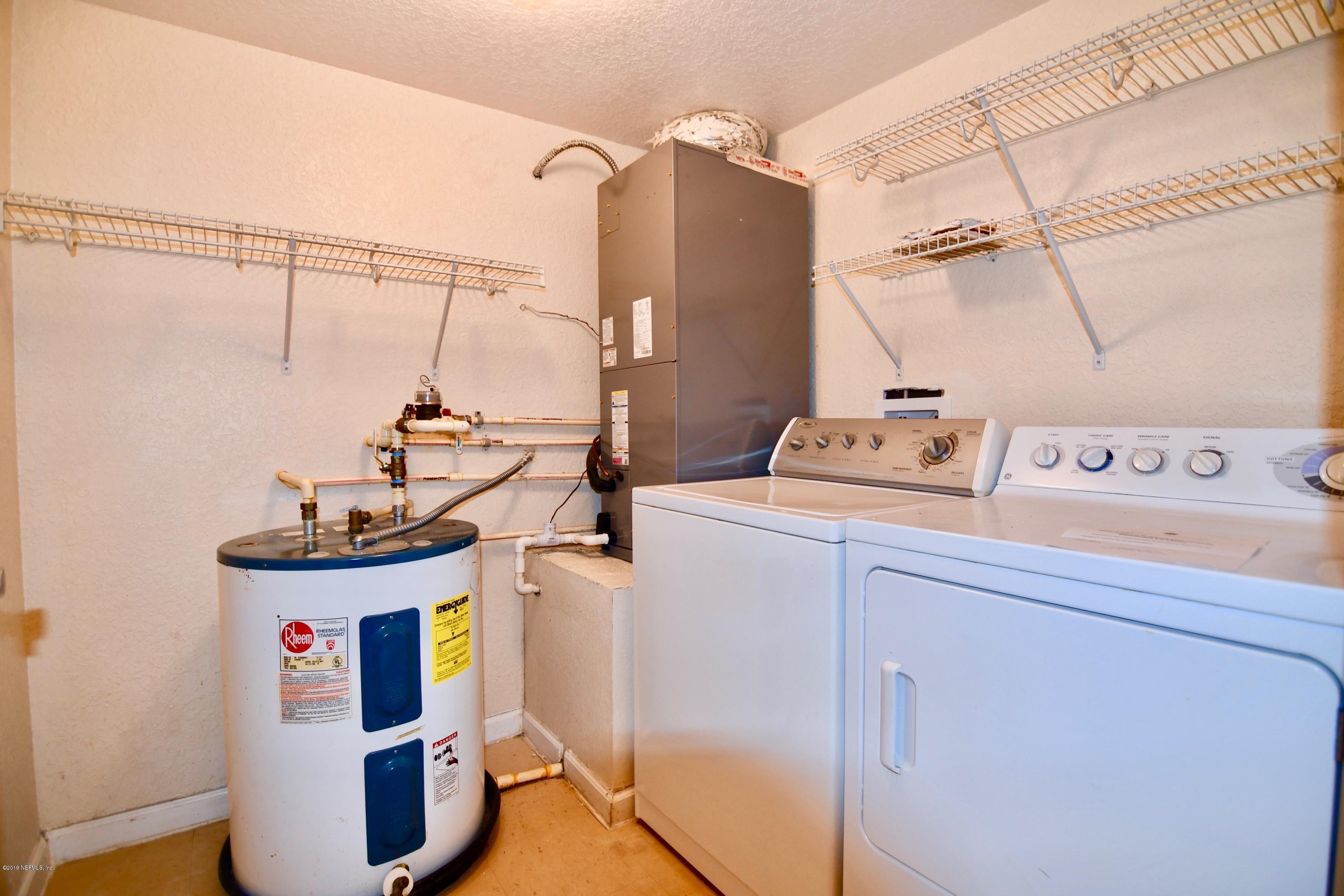 10075 Gate Parkway North, Unit 604 Jacksonville, FL 32246 - Photo 15 of 35 a utility room with dryer and washer